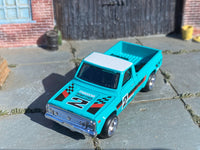 Teal-and-white Mazda REPU custom Hot Wheels, front view with chrome bumper