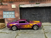 Metallic-purple custom 1966 Shelby GT 500 with yellow flames, right-side view