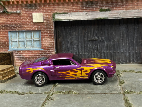 Metallic-purple custom 1966 Shelby GT 500 with yellow flames, right-side view