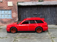 Red Audi Avant RS2 custom showing matching wheels and rubber tires