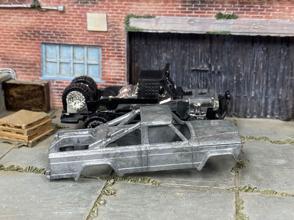Disassembled 1973 Jeep J10 DIY kit with stripped body and chassis components