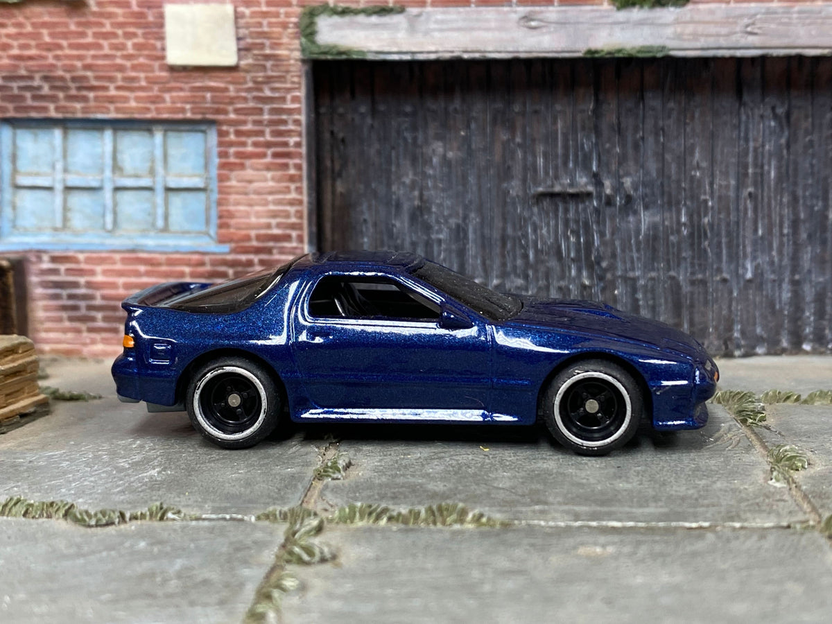 Blue 1989 Mazda RX-7 Savanna custom Hot Wheels, front three-quarter view