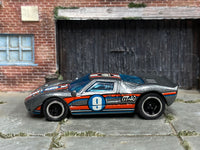 Metallic-silver custom Ford GT-40 with number 9 roundel, left-side view