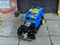 Blue and black custom 1940 Ford Woody with exposed chrome engine, front view