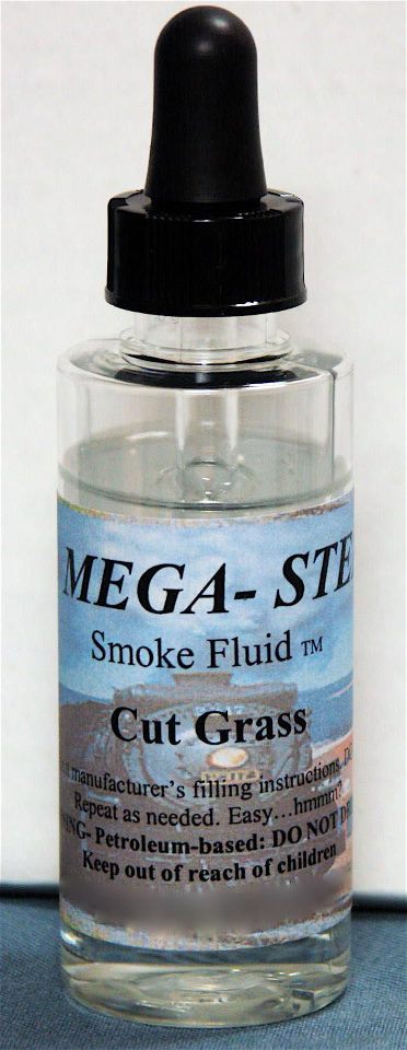 JT's Mega-Steam 138 Cut Grass Smoke Fluid 2 oz actual labeled glass bottle photograph 1