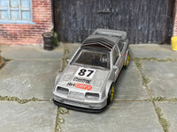 Custom 1987 Ford Sierra Cosworth with rubber tires, rear three-quarter view