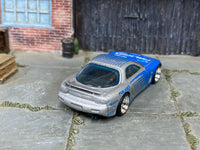 1995 Mazda RX-7 custom with rubber tires, rear three-quarter view