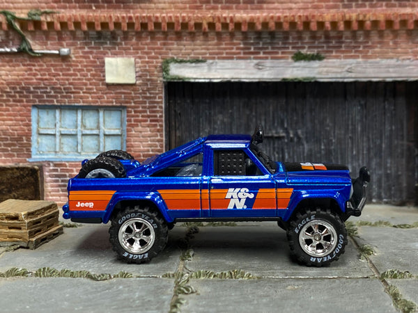 Blue 1973 Jeep J10 custom with K&N graphics, right-side view