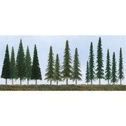 Representative pine, conifer and spruce trees from JTT 92118, shown planted in a scenery strip; the pack contains 90 trees.