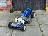 Blue custom Rigor Motor dragster with translucent canopy and exposed engine, front view