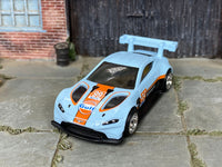 Custom Aston Martin Vantage GTE with rubber tires, rear three-quarter view
