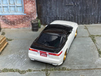Pearl-white Subaru SVX custom Matchbox, rear view with black spoiler and SVX plate