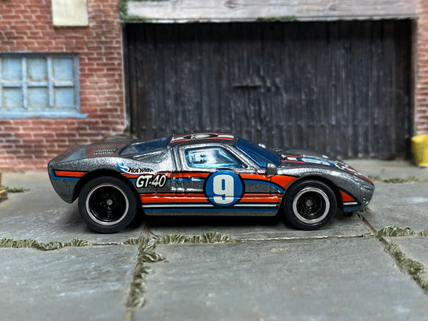 Metallic-silver custom Ford GT-40 with number 9 racing graphics, right-side view