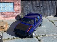 Metallic-blue Volkswagen Golf custom Hot Wheels, front view with black hood