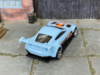 Custom Aston Martin Vantage GTE with chrome mag wheels, side view