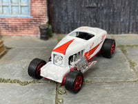Custom Max Steel with rubber tires, rear three-quarter view