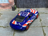 Custom 2018 Ford Mustang GT showing roof stars and red wheels, rear three-quarter view