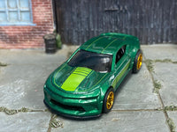 Metallic-green Camaro SS custom Hot Wheels, front view with lime hood stripe