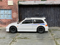 White Honda Civic EF with GREDDY graphics, opposite side view