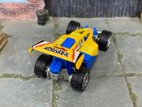 Shock Factor custom with off-road rubber tires, rear three-quarter view