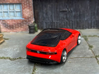 Red custom 2023 Nissan Z with black roof and chrome wheels, rear three-quarter view