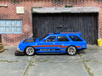 Blue-and-red Nissan Maxima custom car, opposite side view