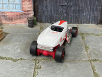 Custom Max Steel with red mag wheels and Goodyear-marked tires, side view