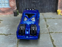1973 Jeep J10 custom showing roll bar and two bed-mounted spare tires, rear view