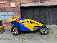 Yellow-and-blue Shock Factor custom Hot Wheels, front three-quarter view
