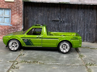 Green Volkswagen Caddy custom vehicle, opposite side view