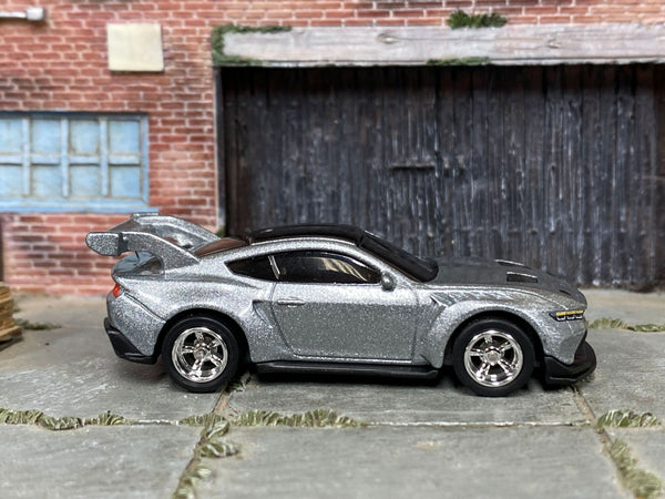 Silver Ford Mustang GTD custom Hot Wheels, front three-quarter view