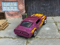 Purple custom 1966 Shelby GT 500 showing flame graphics and chrome wheels, rear three-quarter view