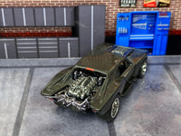 Gunmetal-gray Gotham Batmobile custom Hot Wheels, rear view with chrome exposed engine