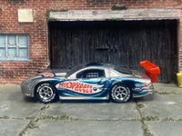 Silver and blue Olds Aurora GTS-1 custom with Falken tires, left-side view