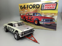 AMT 1383 Ford Galaxie completed model example with tow bar beside the kit box