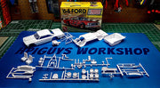 AMT 1383 Ford Galaxie unpainted model parts laid out beside the kit box