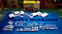 AMT 1383 Ford Galaxie unpainted model parts laid out beside the kit box