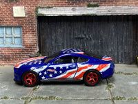 Blue custom 2018 Ford Mustang GT with red-and-white stripes, left-side view