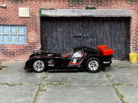 Black-and-red Panoz GTR-1 custom car, opposite side view