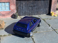 Metallic-blue Volkswagen Golf custom Hot Wheels, rear three-quarter view
