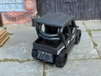 Metallic-gray Kawasaki Teryx4 custom Matchbox, rear view with open cargo bed