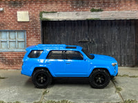 Blue 2018 Toyota 4Runner custom Matchbox, right side with black off-road wheels