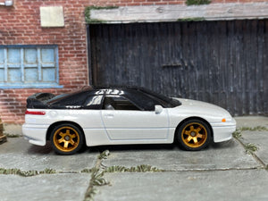 Pearl-white Subaru SVX custom Matchbox, left side with gold six-spoke wheels