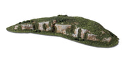 Woodland Scenics C1321 Rocky Ridge Small, finished green terrain with exposed rock faces.