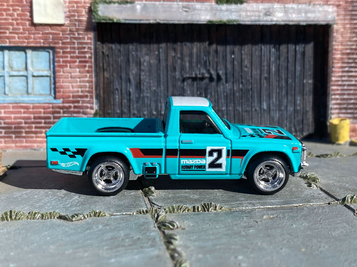Teal-and-white Mazda REPU custom Hot Wheels, right side with number 2 graphics