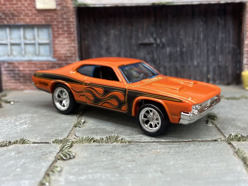 Close-up of Hot Wheels rubber tires and chrome mag wheels on a custom diecast car from Muncle Mikes