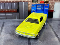 Yellow 1970 Plymouth Cuda custom Matchbox, front view with hood scoop and silver grille
