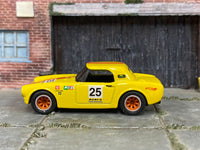 Yellow-and-red Honda S800 Racing car, opposite side view