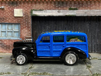 Custom 1940 Ford Woody showing Wild Waves graphic and roof artwork, left-side view
