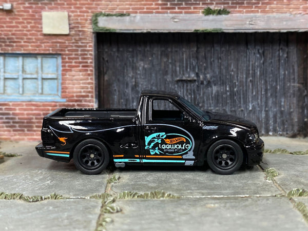 Custom F150 SVT Lightning in black, front three-quarter view